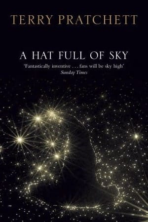 Book cover of A Hat Full of Sky with a witch's hat outlined by starts.